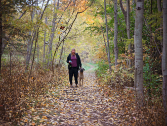 Walking dog in fall Trail
